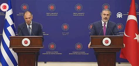 Turkish and Greek foreign ministers discuss troubled ties in a more friendly climate