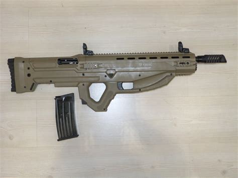 Turkish bullpup shotgun. Top: Mossberg 590 7-Shot. Bottom: Smith & Wesson M&P 12, 14-shot capacity and 8-inches shorter. Instead of a 16-inch barrel giving your rifle 3-plus inches of overall length, a bullpup can have a 20-inch barrel of the same overall length. Or you can have a shorter barrel and make a very compact firearm. 