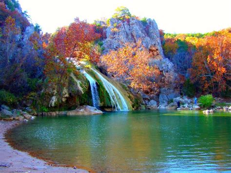 Turner falls park. The Turner Falls area has a number of trails that lead explorers to views of the highlight of the park, a 77 foot waterfall, and numerous caves. There is also a castle style ruins to explore. There are numerous routes to take to hike the area. Hikers usually start at Turner Falls and then venture up above the falls to the caves and hills above. $16 Entrance Fee, $9 for Children, Military, and ... 