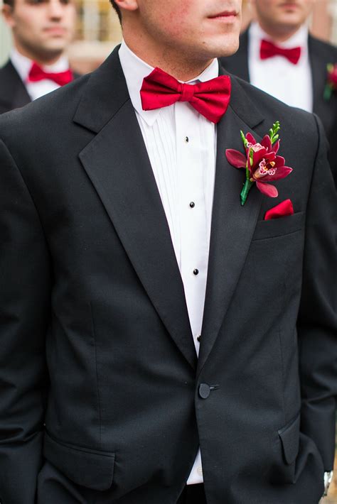 Tux with tie. Black tie usually means semi-formal, and calls for a tuxedo and black tie outfit. A black tie outfit includes: A black tuxedo-style jacket with a shawl collar or peaked lapels. Matching black trousers with a stripe of satin down each leg. A plain white shirt with French-style cuffs. A plain black bow tie in satin or grosgrain. 