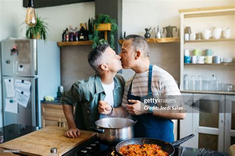 Two Men Kissing While Cooking / 2 Guys