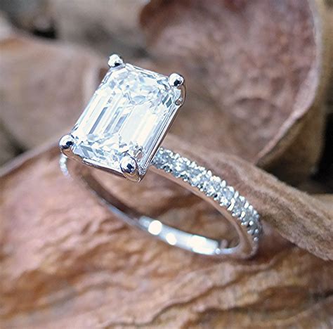 Two carat emerald cut diamond ring. CUT DIAMOND RING. The emerald cut diamond is one of the oldest diamond shapes with origins that trace back to the 1500s. The official term “emerald cut” was coined in the 1920s and the style became very popular with the rise of Art Deco. With its long, elegant lines and eye-catching size it’s easy to see why many celebrities favor emerald ... 