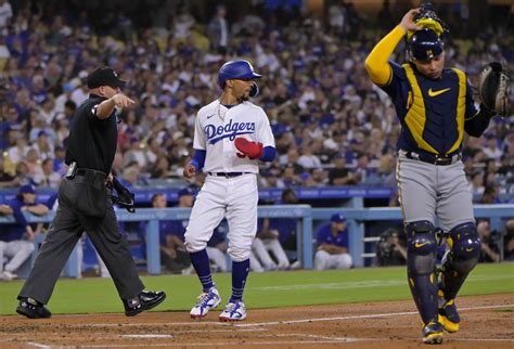 Two catcher’s interference calls help Dodgers beat Brewers 7-1 for 10th straight win