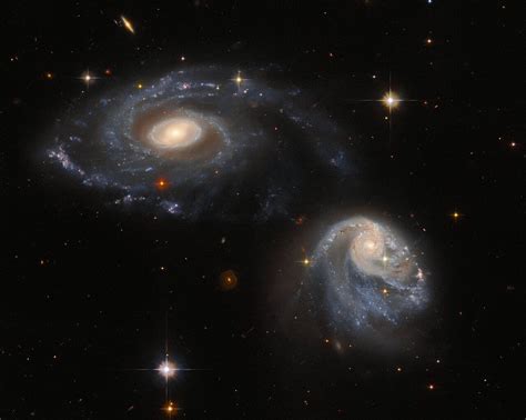 Two interacting galaxies warped by gravity in Hubble image Digital Trends