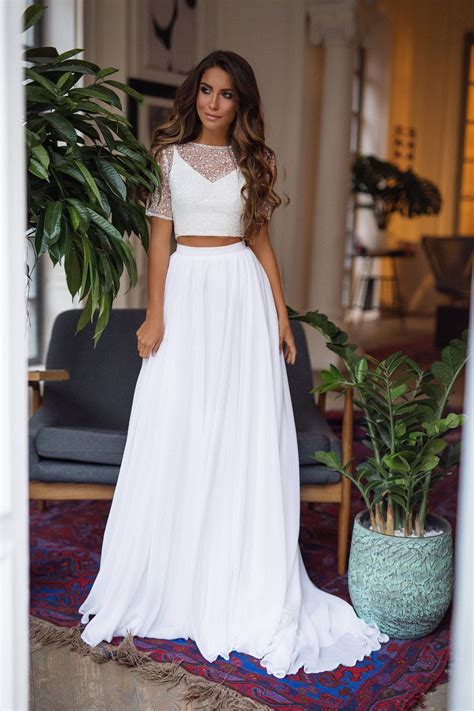 Two piece wedding dress. Two-piece wedding dresses are turning up in the fall 2015 lines of a number of designers who are showing them in their ateliers and at the New York International Bridal Week shows, which began ... 