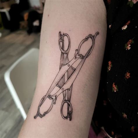 Two scissors tattoo.  It can be your personality, values, or friendship. com Open Share Ad...