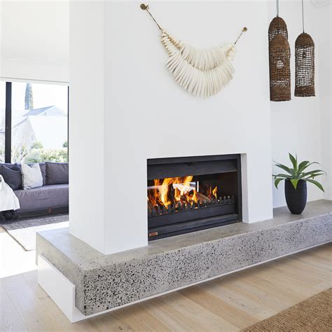 Two sided fireplace. Browse living room decorating ideas and furniture layouts. Discover design inspiration from a variety of living rooms, including color, decor and storage options. 