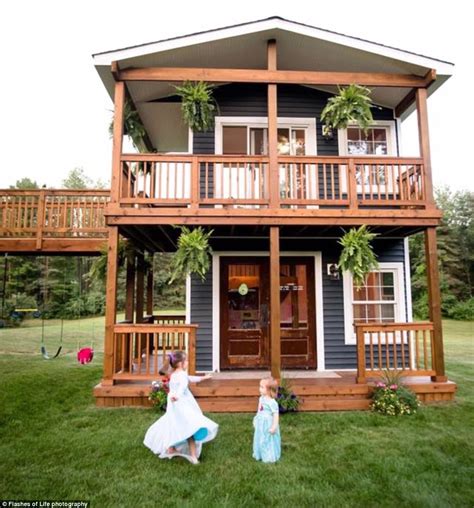 Two story playhouse. The beautiful white and black farmhouse design will create a stunning addition to any backyard. The Reign Two Story Playhouse includes a built-in kitchen, beautiful wooden … 