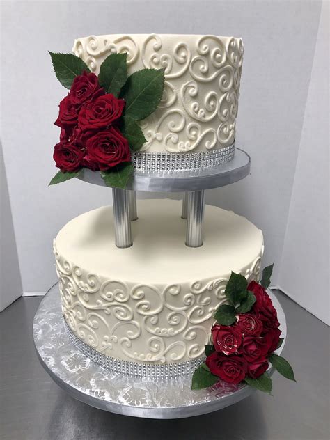  They not only created a work of art, but something that was delicious and way beyond what we could've asked for! It was less than $300 in total for a two tier (10 inch with 8 inch on top) wedding cake (red velvet cake with cream cheese filling on top & marble cake with vanilla custard bottom) which is honestly very affordable. . 