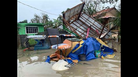 Typhoon blows off roofs, floods villages and displaces thousands in northern Philippines