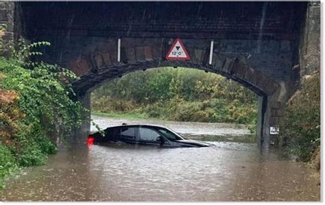 UK weather: Two bridges washed away in floods after evacuations …