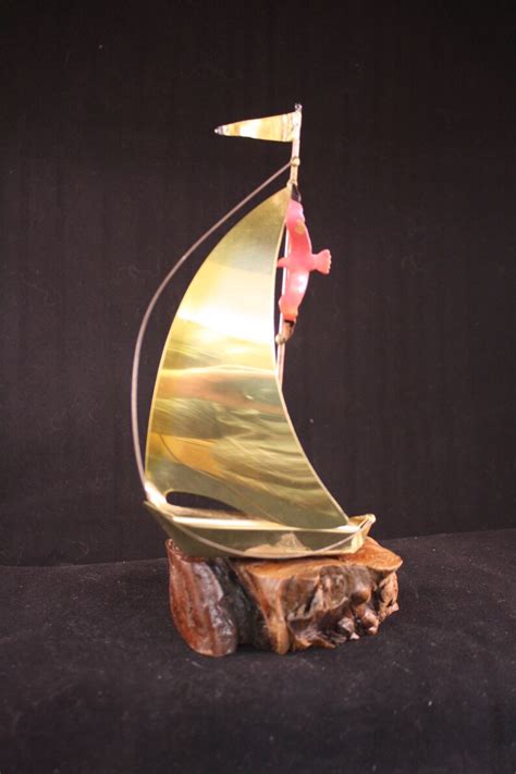 UNDER WAY BRASS SAILBOAT SCULPTURE ORNAMENT ON BURL …