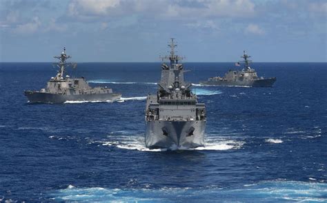 US, Japan and Australia plan joint navy drills in disputed South China Sea, Philippine officials say