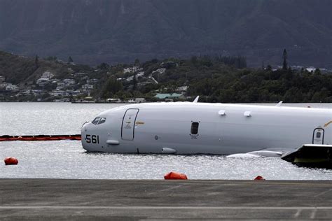 US Navy releases underwater footage of plane that overshot a runway floating above Hawaii reef