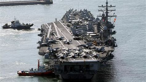 US aircraft carrier arrives in South Korea as North’s leader Kim exchanges messages with Putin