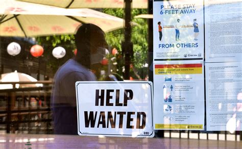 US applications for jobless benefits inch down, remain at historically healthy levels