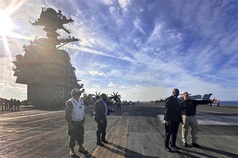 US defense secretary makes unannounced visit to USS Gerald R Ford aircraft carrier defending Israel