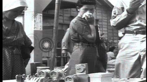 US soldiers and Japanese civilians in Tokyo, Japan, during …