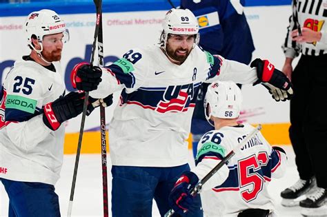 US upsets defending champ Finland, Canada routs Latvia to open ice hockey worlds