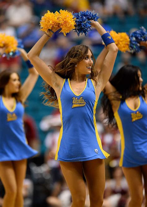 Ucla cheer. A couple of UCLA cheerleaders warm up the crowd before Saturday's basketball game against USC. USC's Marcus Johnson goes up for two of his 10 points during Saturday's game against the UCLA Bruins. 