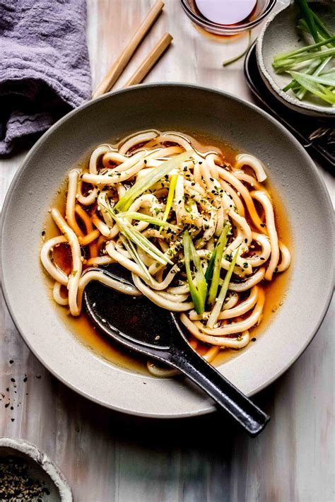 Udon recipes. Heat a frying pan over medium-high heat until hot. Add the oil and then the chicken, skin-side down. Let the chicken fry undisturbed until the skin-side is browned (about 2-3 minutes). While the chicken is browning, grate the onion, carrot, garlic, and ginger. Then mix in the baking soda. 