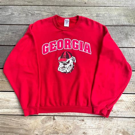 Uga crewneck. Check out our uga sweatshirt pullover selection for the very best in unique or custom, handmade pieces from our hoodies & sweatshirts shops. 