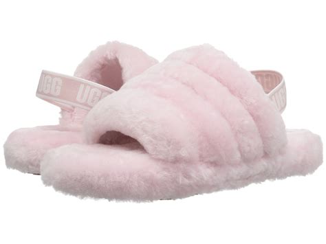 Ugg fluff yeah slide big kid. Even the littles deserve a bit of lux, with these cozy little and big girl fluff Yeah slides from UGG. Open-toe slides. UGG® logo on heel strap. Sheepskin wool lining to naturally wick away moisture. Real Fur Origin: Australia, Ireland, United Kingdom or United States; Origin of finished product: China or Vietnam. Genuine pieced, dyed sheepskin. 