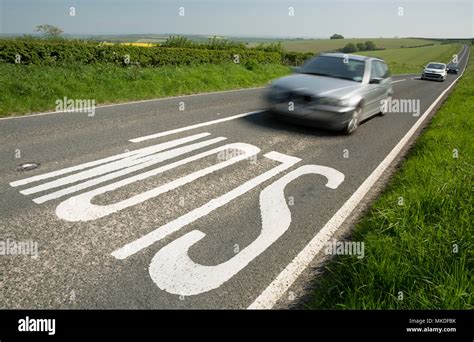 Uk slow road markings hi-res stock photography and images - Alamy