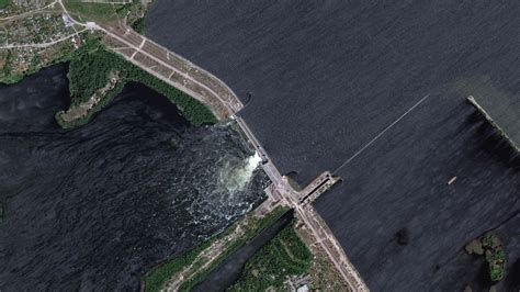 Ukraine accuses Russian forces of blowing up a major dam on the Dnipro River and orders evacuations from flood zones