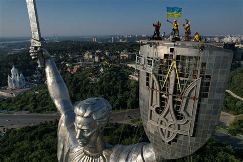 Ukraine replaces Soviet hammer and sickle with trident on towering Kyiv monument