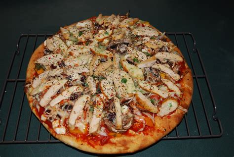Ultimate pizza. Oven. Heat oven to 425F / 218C degrees and position top rack so it’s at the very top. Brush dough with some oil. Bake dough on the top rack for 3 minutes without toppings to let it crisp up. Spread sauce over dough, then cover with toppings. Bake pizza on the top rack for 8 to 11 minutes until golden. 