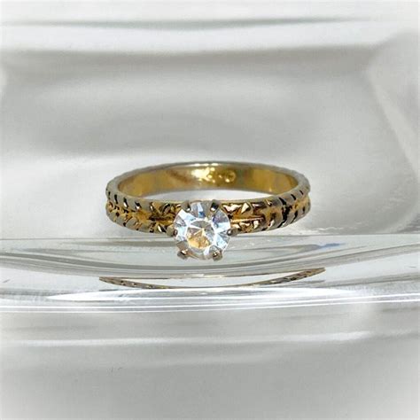 Uncas ring value. It is gold plated and accented by simulated diamonds and silver tones. MadSky 10I. Final Sale. Display materials are not included in sale. 