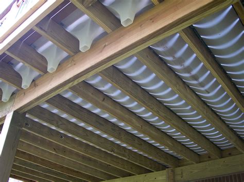 Under deck drainage system. UpSide Deck Ceiling is a complete system that transforms your under deck area into a dry and enjoyable outdoor living space. The Simple Deck Ceiling Solution Easy to install and effortless to maintain, the UpSide Deck Ceiling adds modern style and functionality to any under deck area. 