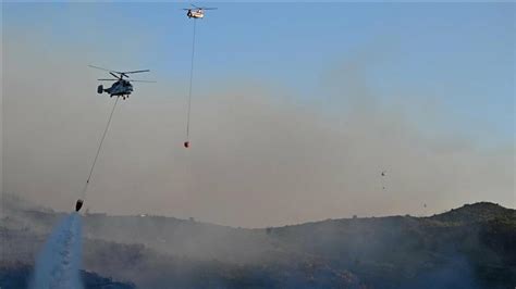 Underwater teams search for a helicopter that crashed while fighting a forest fire in western Turkey