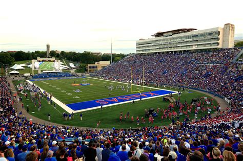The University prohibits individuals from possessing, carrying or using weapons, including concealed weapons, in David Booth Kansas Memorial Stadium for football games. Violators will be asked to leave University property, and if they refuse to do so, such refusal may constitute an unlawful trespass.