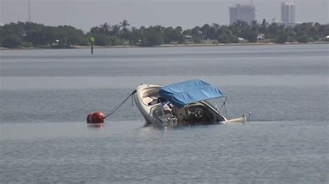 Unoccupied boat sinks off of Margaret Pace Park in Miami