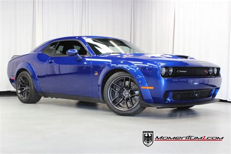 Used dodge challenger scat pack widebody for sale. The Dodge Challenger R/T Scat Pack Widebody has an MSRP of $53,235. Used examples on CarGurus range from $43,812 to $77,418 with an average price of $32,396. There are multiple option packages that impact the price of both new and used Challenger R/T Scat Pack Widebodys, including the $2,595 Shaker Package with a Shaker hood … 