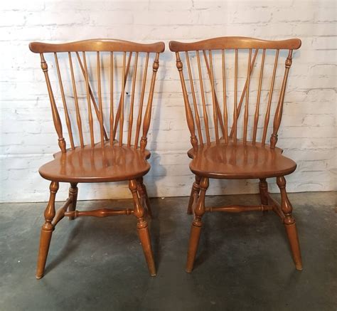 Late 20th Century Ethan Allen Classic Manor Collection - Maple Double Pillar Table With 2 Leaves, 2 Armchairs and 4 Chairs - Set of 7. $4,675.. 