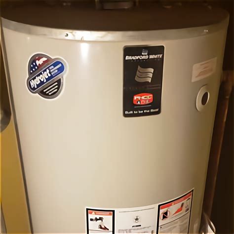 A pipe from the boiler bearing hot water enters the bottom of the indirect water heater. The pipe coils in loops inside the water heater tank, then leaves the water heater to be redeposited in the boiler. Both the boiler and the water heater remain separate devices. Water from the boiler's pipe never touches water in the water heater tank.. 