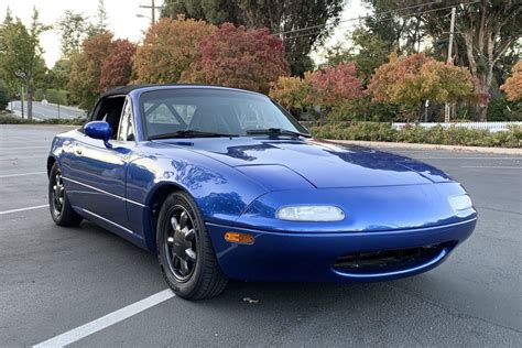 Used miata. Mileage: 2,991 miles MPG: 26 city / 34 hwy Color: Gray Body Style: Convertible Engine: 4 Cyl 2.0 L Transmission: Manual. Description: Used 2022 Mazda Miata Grand Touring with Rear-Wheel Drive, Alloy Wheels, Hard Top, Navigation System, Keyless Entry, Leather Seats, Heated Seats, Wind Deflector, 17 Inch Wheels, Bose Sound System, and Power Top. 