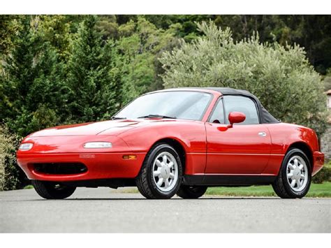 The Mazda MX-5 Miata, a sports car debuted by Mazda in 1989, is a classic roadster that harkens back to iconic British sports cars of the 1950s and 60s like the MGA, Triumph Spitfire and Austin-Healey 100. While not a speedster--the 4 cylinder engine nixes that definition--the Miata has clean, classic lines, a tight turning radius and plenty of ... .