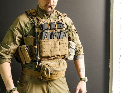 The plate carrier is sized based on the size of your hard plates. For me, that’s a medium. My carrier came with a cummerbund, which Velcro’s in the front and back and can be adjusted to fit by letting it out in the back of the carrier. ATS Aegis plate carrier front and back, semi stripped of pouches. The cummerbund contains side plate pockets.. 