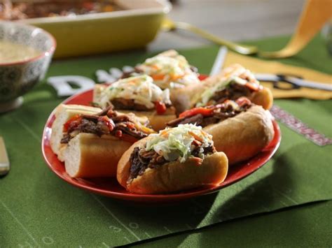 Valerie bertinelli italian beef sandwiches. Instructions. Preheat oven to 350 degrees. Slice baguette into 1/2 inch slices on the diagonal. Melt the butter in a small dish and brush each piece of bread. Smash 1-2 cloves of garlic and rub on the bread. Place bread on a baking sheet and toast for 5-7 minutes. Remove and set aside. 