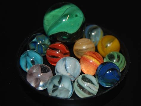 Uranium Containing Marble (ca. 1960s) Marbles. These sure do bring back memories. Marbles and trading cards, the coin and paper currency of my elementary school days. Times have probably changed. Some of the old cats eye marbles, possibly other types as well, owed their yellow color to uranium. The marble to the left of the above photo has a ...