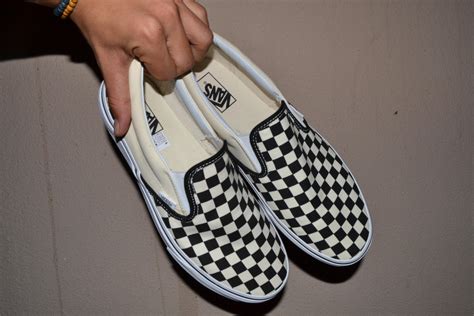 Wash Vans shoes by brushing off dirt, removing the shoelaces, washing them with Woolite or another mild detergent, and letting them air dry. The Vans company warns wearers not to w.... 