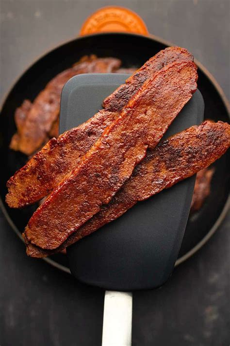 Vegan bacon. Preheat your oven to 350 °F and prep a baking tray by covering with parchment paper or a silicone baking mat. When the TVP has fully absorbed the liquid, spread in a thin layer over the baking tray. Bake for 30 minutes, tossing your … 