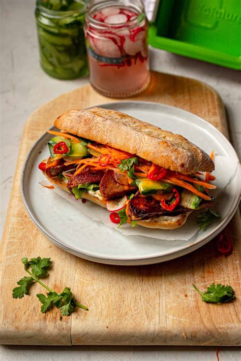 Vegan banh mi. May 31, 2018 · Make the Creamy Sriracha Dressing: place ingredients in a small bowl and whisk. Make the Crispy Tofu: Heat oil in a skillet, and season the oil with salt and pepper. Add the tofu and sear over medium heat until all sides are crispy. Stir in a little sriracha for heat at the end. Prep your veggies. 