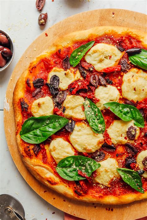 Vegan cheese pizza. Step 1. Prepare the pizza crust, whisk together the flour, salt, sugar and yeast in a mixing bowl. Add the water and use a spoon or your hands to mix everything into a shaggy dough ball. Cover... 