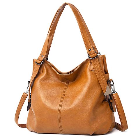 Vegan leather bag. Tote handbags are the most versatile of all bags – that’s only one of the many reasons we love them. Choose from a variety of hot styles and colors in vegan leather, straw, nylon, and canvas. Joy Susan tote handbags have tons of room and extra pockets, so no accessory has to get left behind! Our vegan totes are made … 