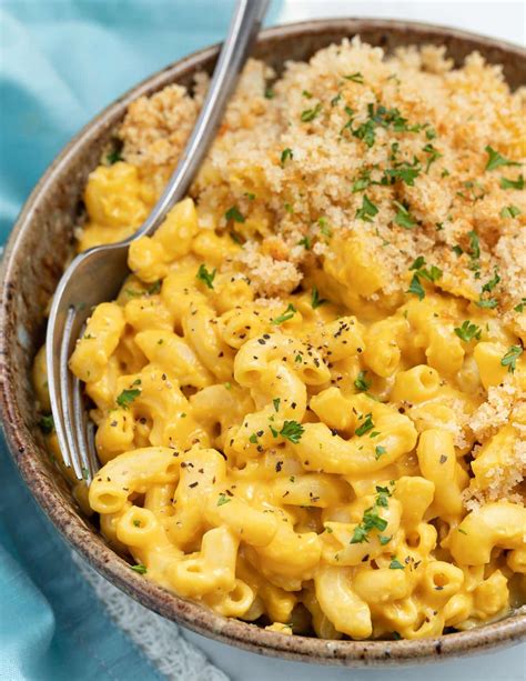 Vegan mac and cheese. Blend until smooth and creamy. Add the pasta to a baking dish and pour the cheese sauce over top (above left), give a good mix. You can eat it as is or continue to the next step and bake. Sprinkle the mac and cheese with bread crumbs (above right) and bake in a preheated oven at 350 degrees for about 25 minutes. 